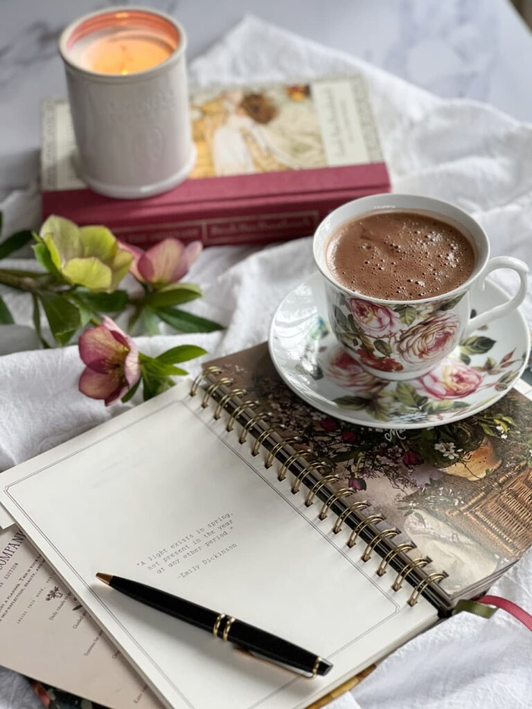 Homemade hot chocolate in a rose covered cup.