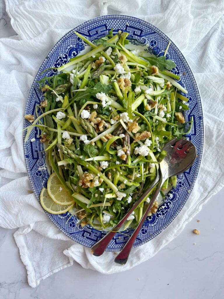 Shaved asparagus salad with arugula, feta and walnuts.