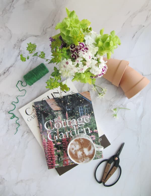 spring bucket list for women over 50~terracotta-pots-garden-books-scissors-and-twine in spring