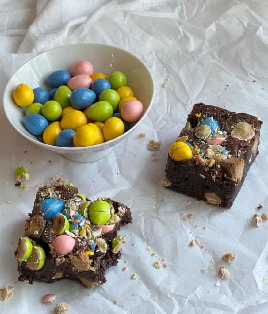 Reeses brownies and a bowl of Reeses pieces.