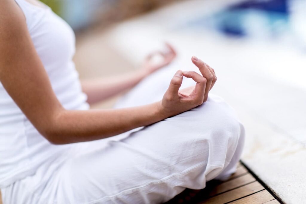 slow morning ritual women over 50 woman in white doing yoga